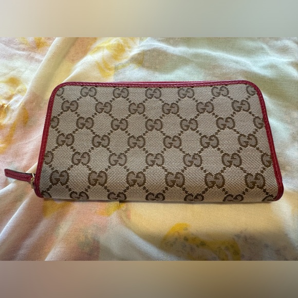 Gucci Handbags - EUC GUCCI GG Logo Canvas Leather Long Zip Around Wallet - Red Approx. 4.5”x7.5”